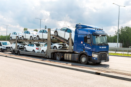 Moscow, Russia - July 12, 2022: Car transporter carries new Renault vehicles along the highway. Car carrier transporter truck on a freewayのeditorial素材