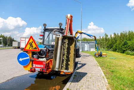 Moscow, Russia - July 12, 2022: Road service wheeled tractors parked in the car park on the toll highway m11のeditorial素材