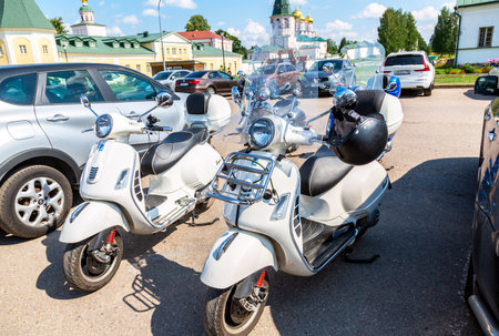 Valday, Russia - August 6, 2022: Typical italian Vespa Motorscooters at the parking lot next the Valdai Iversky Monasteryのeditorial素材