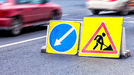 Road sign at the construction site. Keep left road sign at the city streetの写真素材