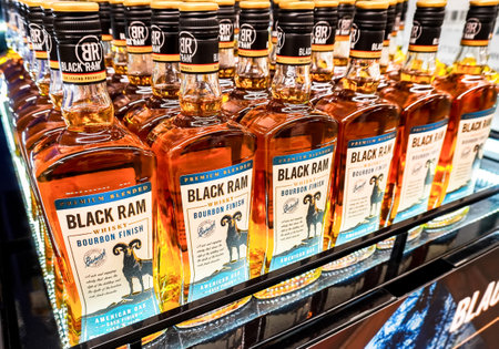 Samara, Russia - March 2, 2023: Whiskey bottles brand Black Ram at supermarket shelf. Bottled alcoholic beverages and spirit drinks. Strong alcoholic beverages. Selective focusのeditorial素材