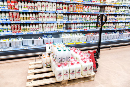 Samara, Russia - May 8, 2022: Various fresh dairy products ready for sale in chain supermarket. Packaged milk as food backgroundのeditorial素材
