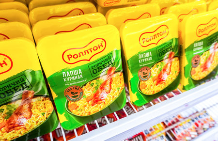 Samara, Russia - April 30, 2023: Rollton chinese noodles in a plastic boxes on the shelf in a superstore. Instant noodles. selective focusのeditorial素材