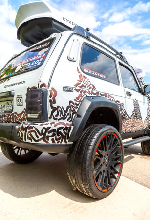 Samara, Russia - May 14, 2023: Tuned off-road vehicle Lada Niva 4x4 parked up on the city street in...