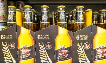 Samara, Russia - May 17, 2023: Miller bottled alcoholic beer on the shelf at a superstore. selective focusのeditorial素材