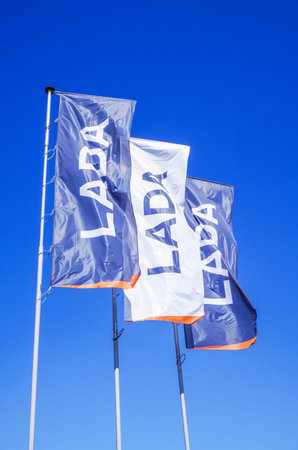 Samara, Russia - May 14, 2023: Flags of Lada official dealer against a blue sky background