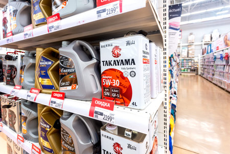 Samara, Russia - September 9, 2023: Takayama and others motor oil on the shelf at a superstore