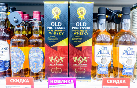 Samara, Russia - November 9, 2023: Old Professor whiskey on the supermarket shelf. Bottled alcoholic beverages and spirit drinks. Strong alcoholic beverages. Selective focusのeditorial素材