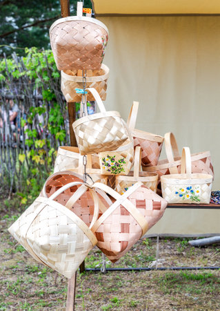 Handmade wicker baskets ready for sale at the local market in summerの写真素材