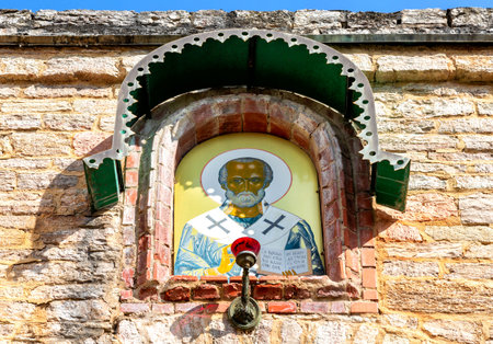 Gate icon of St. Nicholas the Wonderworker on the wall of an ancient temple