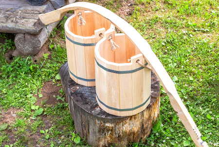 Wooden shoulder yoke with wooden buckets for water