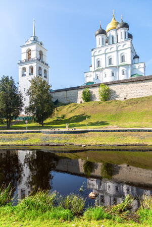 View of the medieval Pskov Kremlin (Krom) and the embankment of the Pskova river in sunny summer day. Pskov, Russiaの写真素材