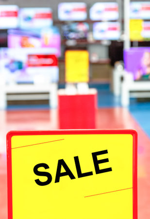 Sale sign on blurred background in electronics storeの写真素材