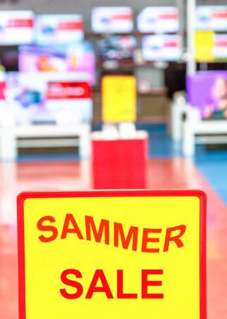 Sammer sale sign on blurred background in electronics storeの写真素材