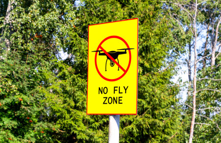 No fly zone sign against a natural background. No drone zone sign