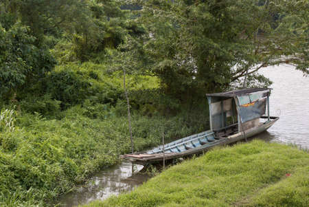 Wooden Boat on the Riversideの写真素材