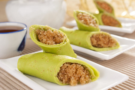 Pandan Pancakes Stuffed with Sweetened Coconut Flakes