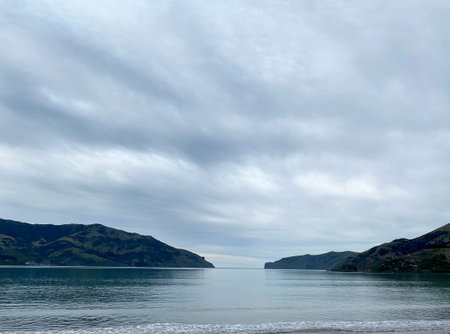 Banks Peninsula, Canterbury, New Zealand. Looking our to the Akaroa heads, on a still, cloudy day....