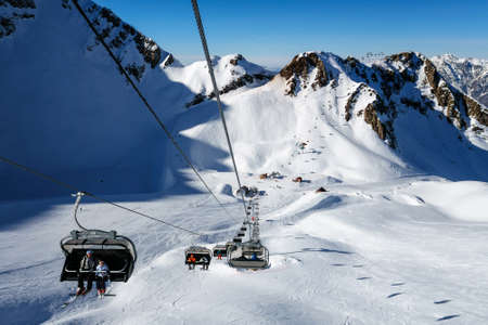 Sochi, Russia - January 20, 2013: Due to the unique microclimate, Aibga cirque ski slopes and chair lifts in Krasnaya Polyana can host ski and snowboard riders right until Juneのeditorial素材