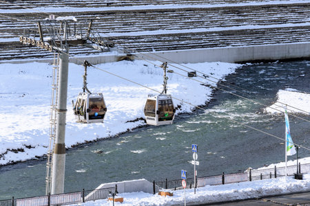 Sochi, Russia - January 9, 2015: Cable car ski lifts in Krasnaya Polyana winter mountain resort can be hosting skiers and snowboard riders right until Juneのeditorial素材