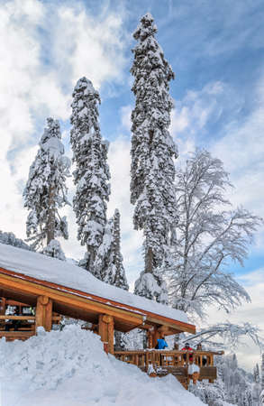 Sochi, Russia - January 9, 2015: Ski slopes and cableway lifts in Krasnaya Polyana winter mountain resort can be hosting skiers and snowboard riders right until Juneのeditorial素材