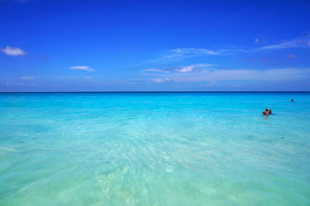 Seychelles Islands - March 14, 2016: Scenic seascape of azure transparent ocean water and blue sky. Tropical beach with white sand. Idyllic scenery of seaside resort.のeditorial素材