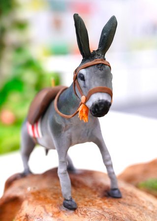 Tiny decorative and colorful figurine of a donkeyの写真素材