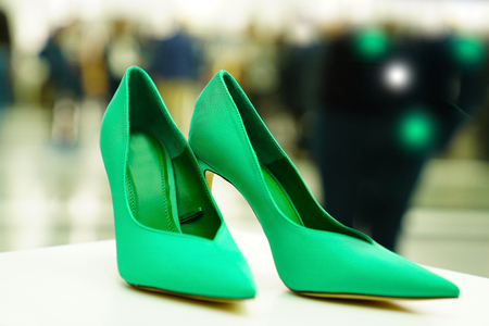 Beautiful green woman shoe in the vitrineの写真素材