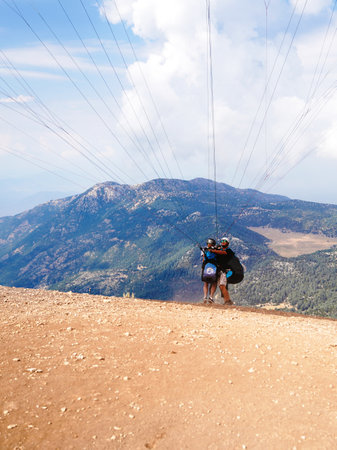 Fethiye, Mugla/Turkey- August 19 2018: Paragliders preparing the equipment on Babadag for the launching / Ready to flyのeditorial素材