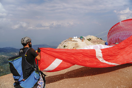 Fethiye, Mugla/Turkey- August 19 2018: Paragliders preparing the equipment on Babadag for the launching / Ready to flyのeditorial素材