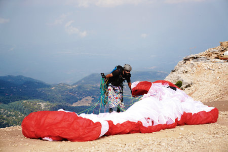 Fethiye, Mugla/Turkey- August 19 2018: Paragliders preparing the equipment on Babadag for the launching / Ready to flyのeditorial素材