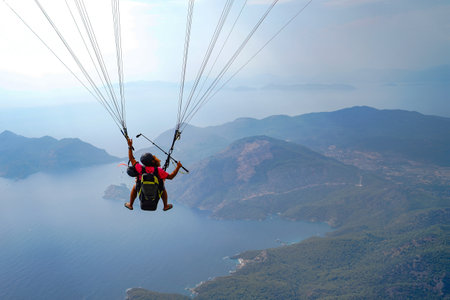 Fethiye, Mugla/Turkey- August 19 2018: Tandem paragliders on Mediterraneanのeditorial素材