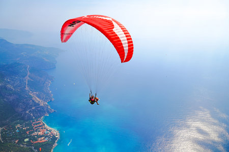 Fethiye, Mugla/Turkey- August 19 2018: Tandem paragliders on Mediterranean Sea.