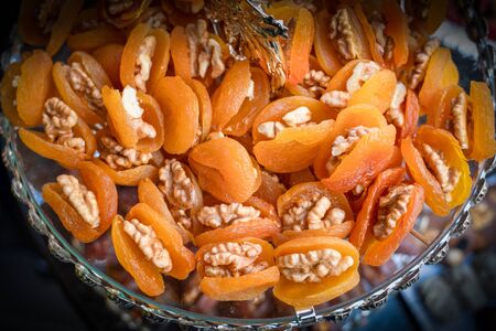 Walnut wrapped in apricot fruit. Many apricots with walnuts.の写真素材