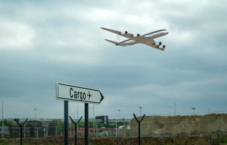 Air cargo sign on ground and a cargo flight on the air