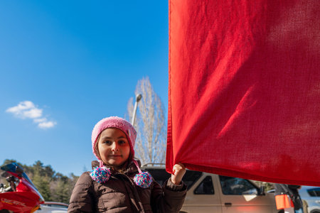 Ankara/Turkey- March 01 2020: Cute girl holding a huge Turkish flagのeditorial素材