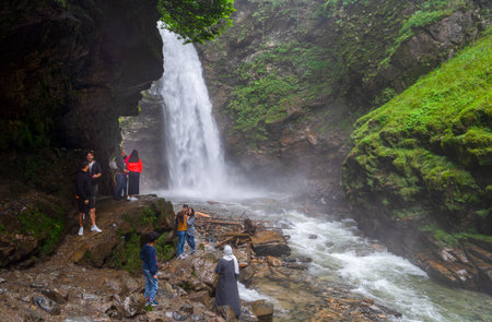Camlihemsin, Rize/ Turkey - August 06 2019: Palovit Waterfall in summer season with tourists and cars.のeditorial素材