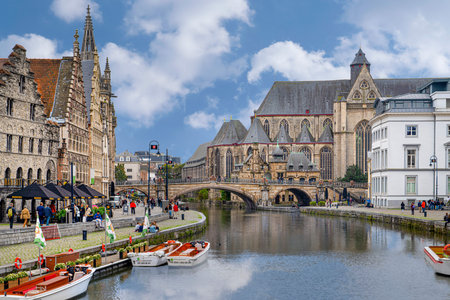 Ghent/Belgium - October 10, 2019: Cityscape with view of Sint-Michielsbrug, Stone arch bridge in the city center and architecture traditional houses along Lys (Leie) river in Gent.のeditorial素材