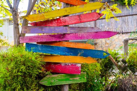Multiple blank signs on a wooden pole in green areaの写真素材