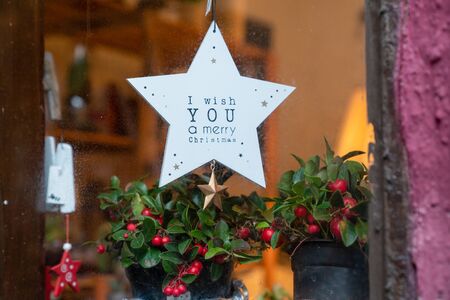 Atmospheric Christmas window sill decoration: snow, tree, candle, rockingの写真素材