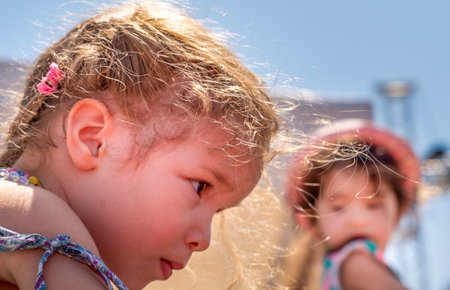 Mengen, Bolu / Turkey - August 03 2019 :  Two little girls looking each other. Communication between cute little girls.のeditorial素材