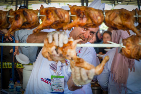 Mengen, Bolu/Turkey - August 03 2019 :  34 nd Mengen Culinary and Tourism Festival (34. Mengen Ascilik ve Turizm Festivali in Turkish).  Longest chicken flipping Guinness record attempt. Free chicken.のeditorial素材