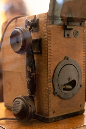 Antique camp telephone used during old wars in 20. century.のeditorial素材