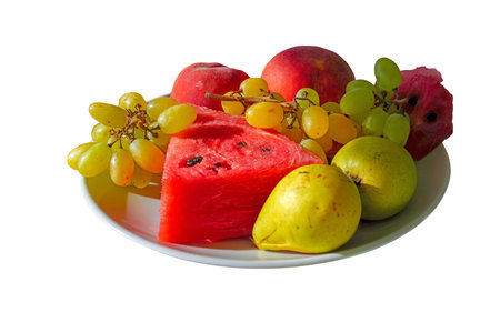Fruit dish with water melon, grape, pear and peach in isolated white background