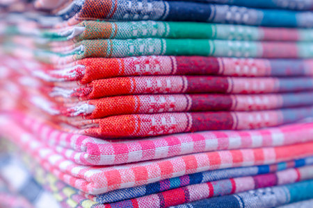 Folded colorful fabric sale in a bazaar
