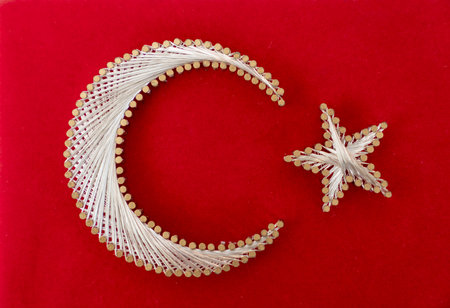 Handmade Turkish flag made of nail and  copper wire on sail in a souvenir shoppingの写真素材