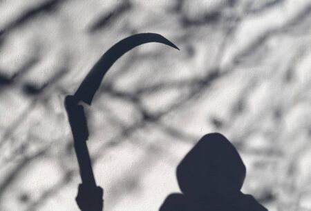 Death coming, Soft shadow of death on wall.の写真素材