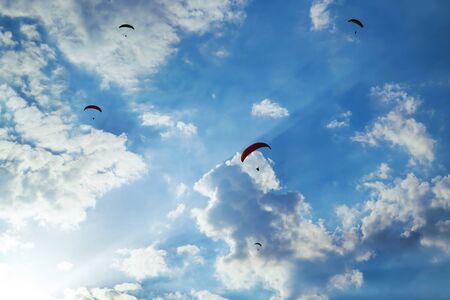 Fethiye, Mugla/Turkey- August 19 2018: Bottom up view of tandem paragliders on sky.の写真素材