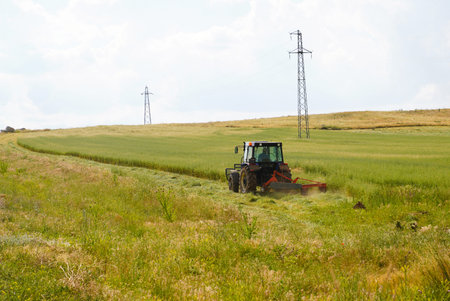 Tractor with mower cutting the meadows in Ankara, Turkey