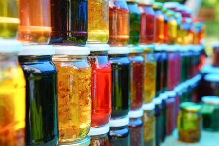 Homemade jam for sale at a farmer's market.の写真素材